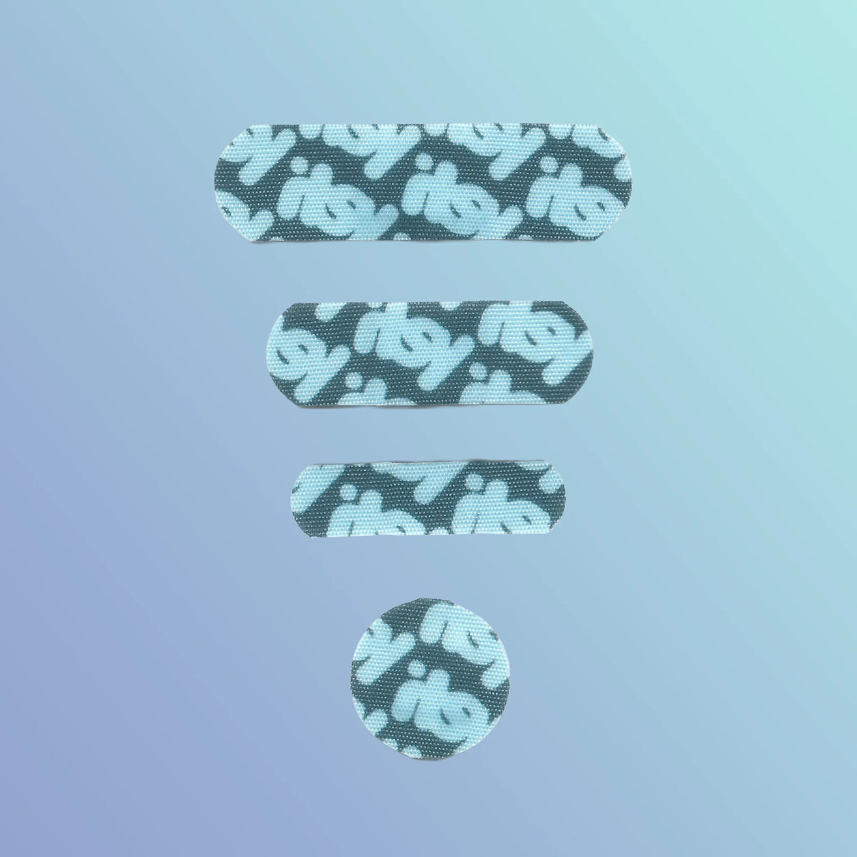 flat lay of itsy blue colorway bandages in round, tiny, small, and medium sizes